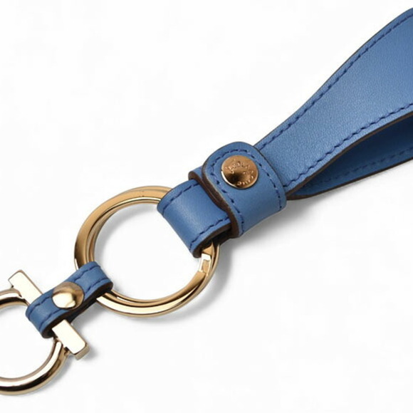 Unused Salvatore Ferragamo key ring holder in blue leather with Gancini strap.
